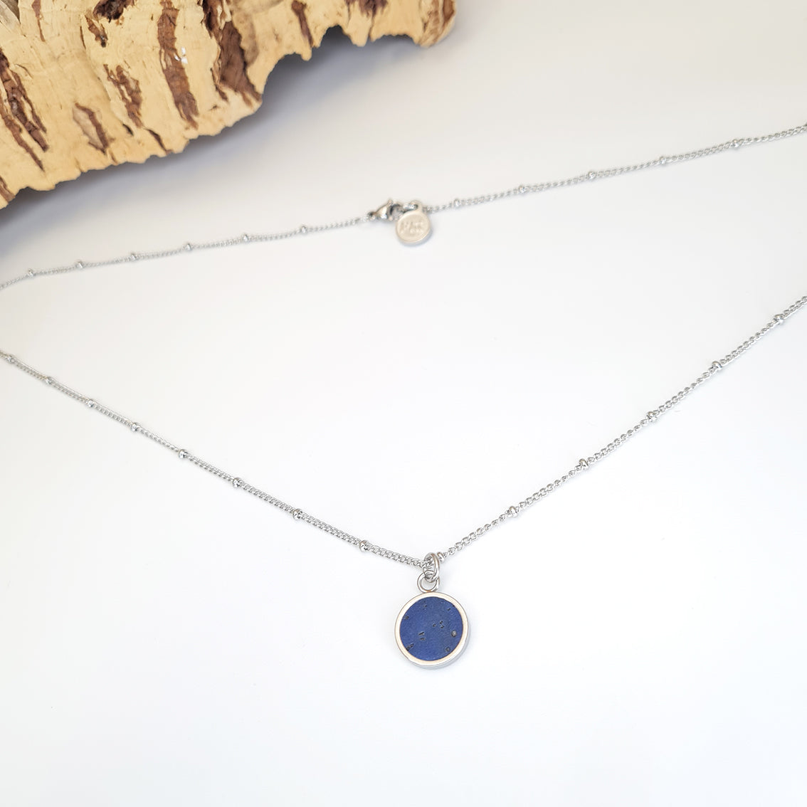electric blue pendant on a dotted stainless steel chain necklace eco vegan