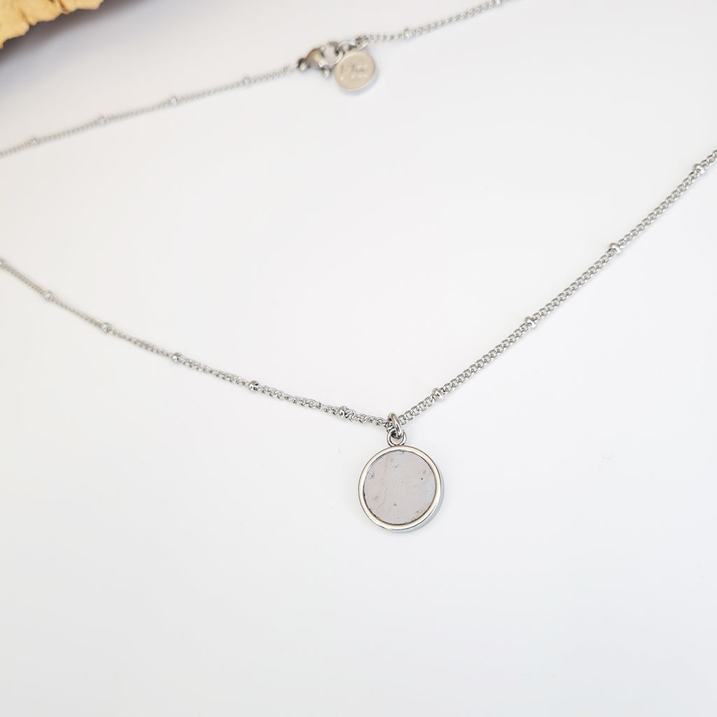 eco cork and steel round pendant on a dotted stainless steel chain