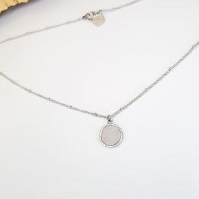 eco cork and steel round pendant on a dotted stainless steel chain